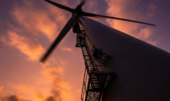 Looking up at a utility-scale wind turbine rotor, illustrating wind energy aerodynamics